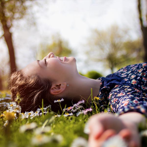 woman laying on the grass