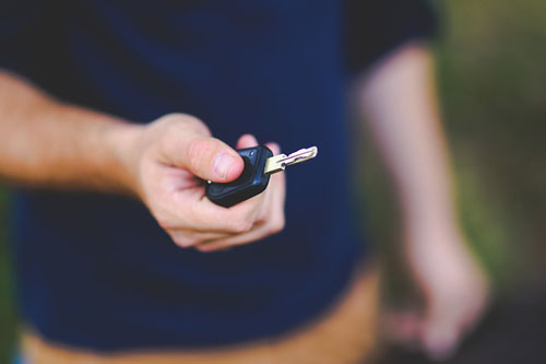 person holding car key