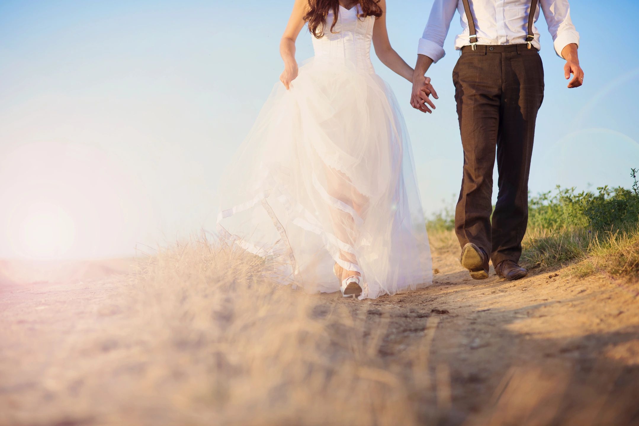 woman in wedding dress with man